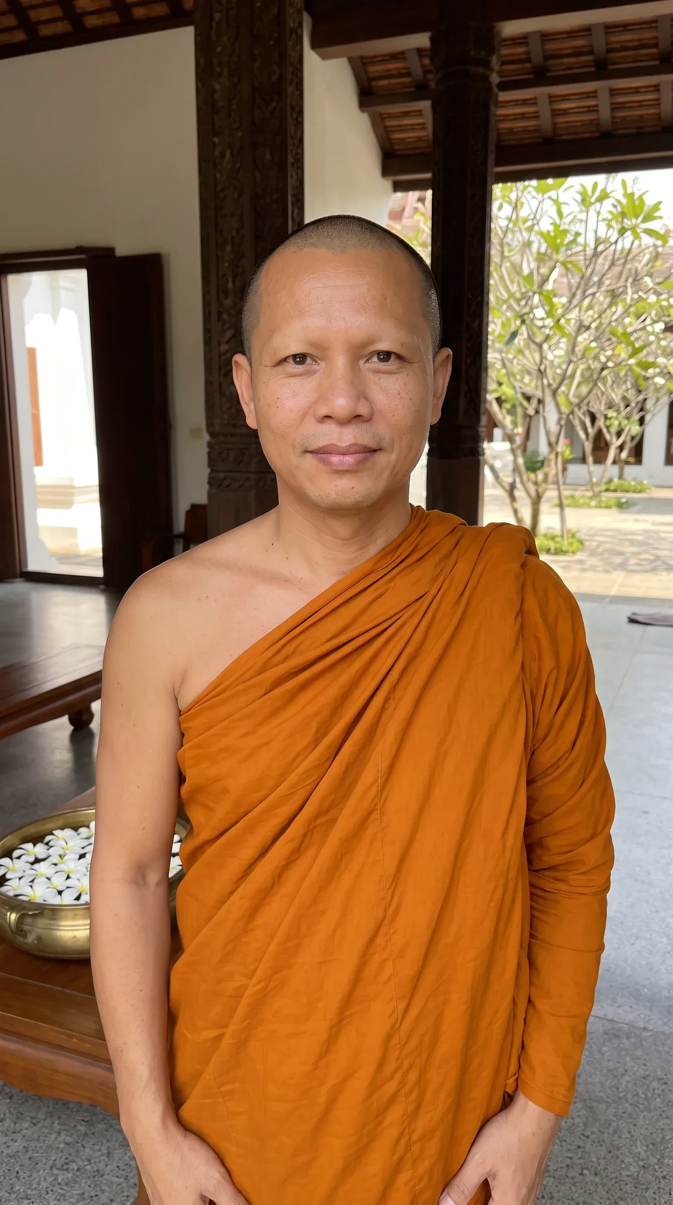 AI-generated Thai Buddhist monk in a saffron robe in an open temple hall