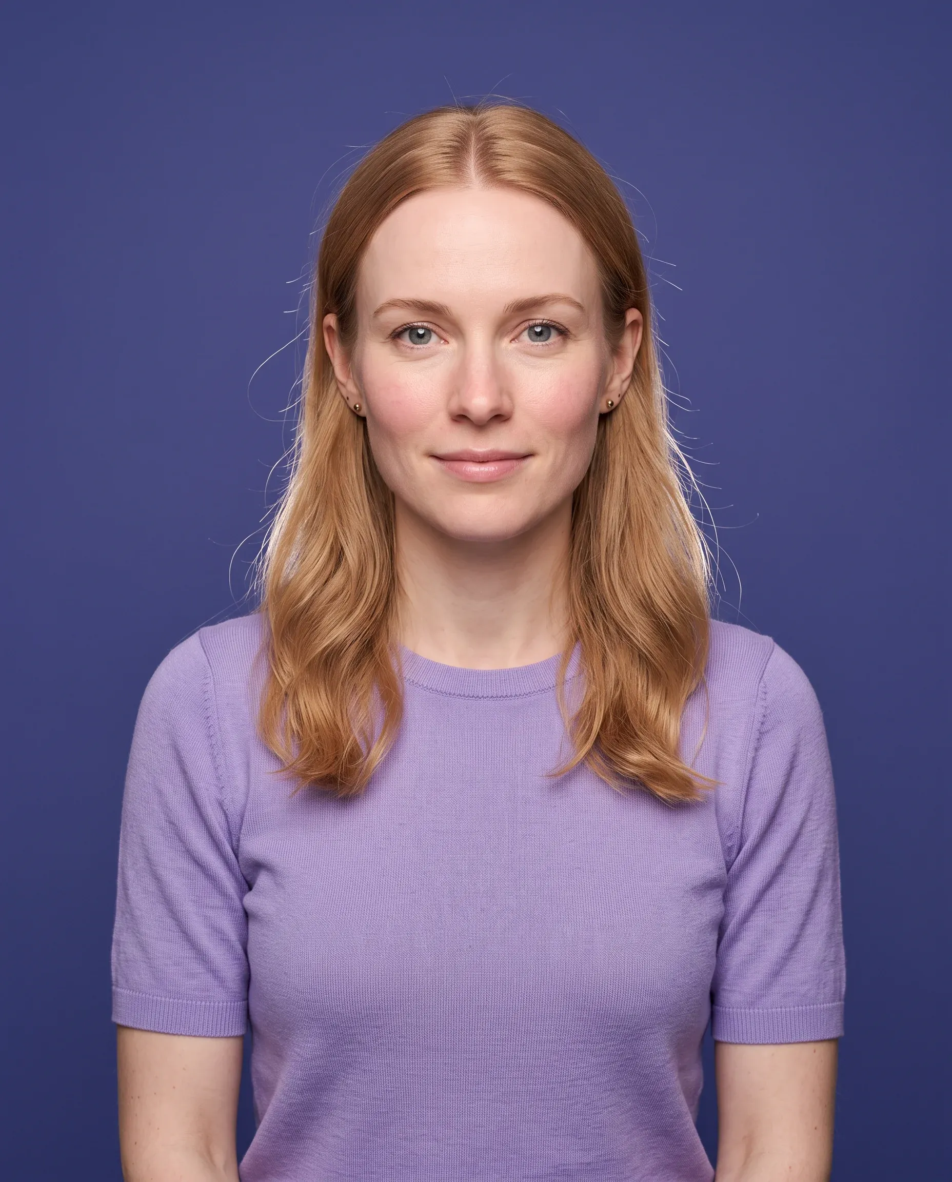 AI-generated woman with strawberry blonde hair in a lavender top