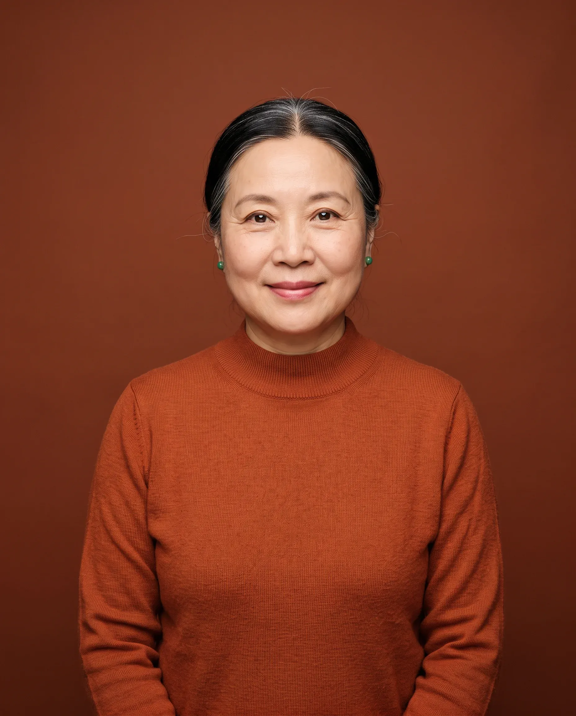 AI-generated woman in her sixties in a burnt orange sweater